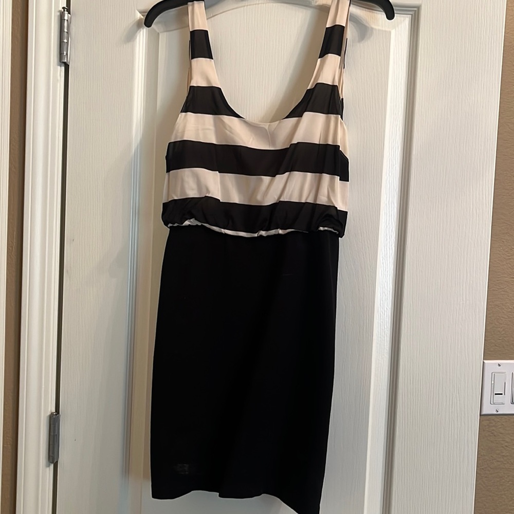 Alice + Olivia mini dress, striped top and solid black body con bottom.